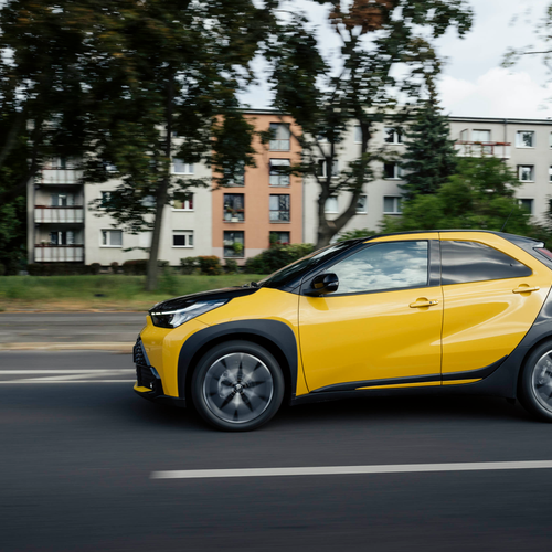 2026 Toyota Aygo X Hybrid Mustard Side View