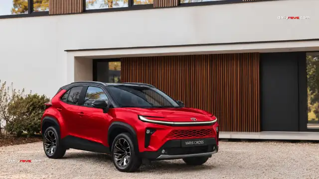 2027 Toyota Yaris Cross Facelift – Red Hammerhead Design Concept 2027 Toyota Yaris Cross facelift concept in metallic red, featuring a Hammerhead-inspired LED light bar, body-coloured honeycomb grille, black roof and alloy wheels in a front three-quarter view.